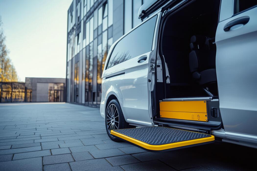 Wheelchair accessible medical transport minivan with an extended ramp