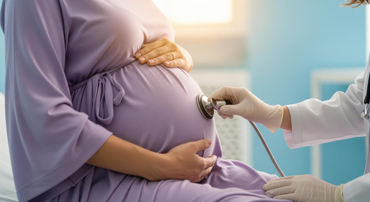 Midwife providing a prenatal checkup to a pregnant woman