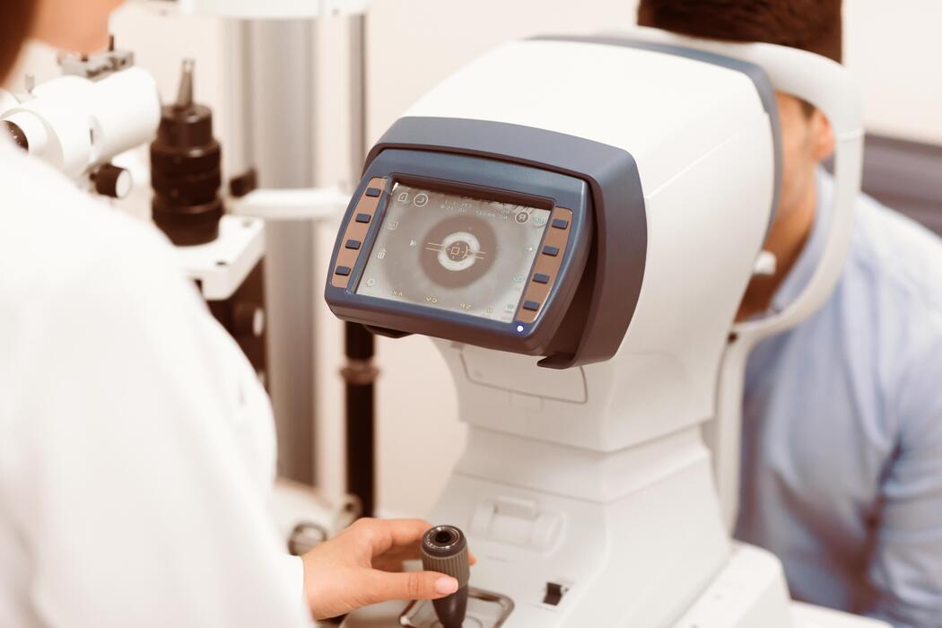 Patient undergoing an eye imaging examination at a neuro-ophthalmology practice