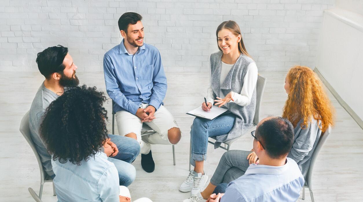 Partial hospitalization program IT support Diverse group in a psychological support session at a partial hospitalization program