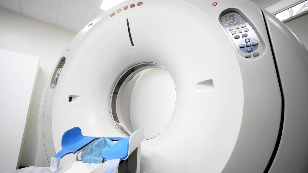 PET scan centers IT support Advanced PET CT scanner and patient bed in a modern molecular imaging suite at a PET scan center