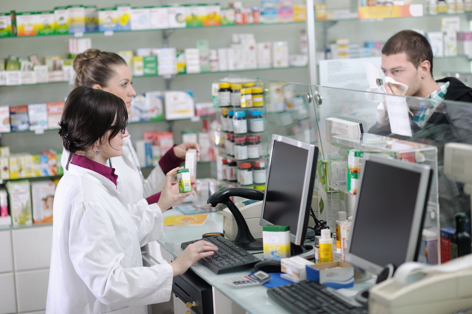 Pharmacy IT Support Pharmacists at computer workstations - IT support for independent pharmacies