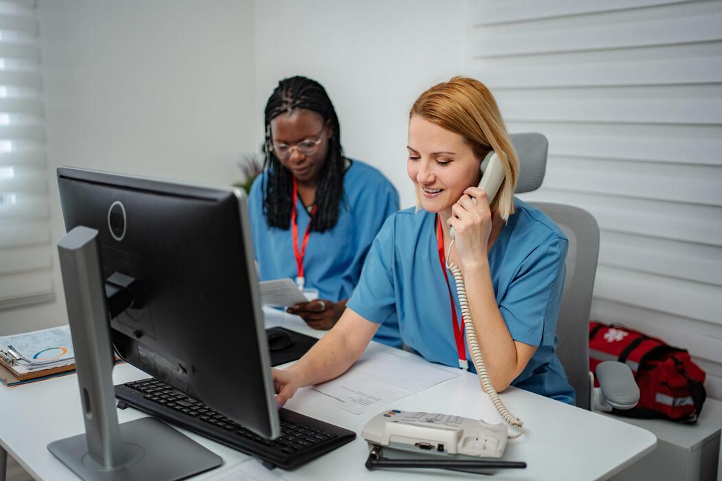 Prior authorization services IT support Healthcare administrative staff processing authorizations and payer calls at a prior authorization service