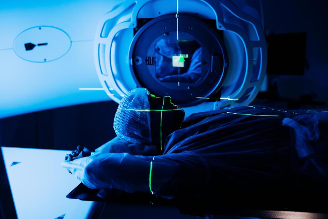 Linear accelerator positioned for radiation therapy in the treatment vault of a radiation oncology center