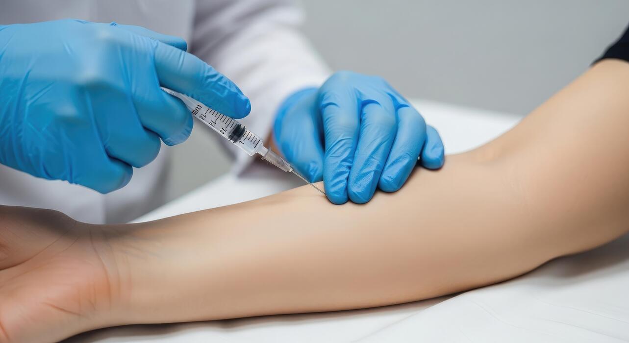 Regenerative medicine clinics IT support Clinician administering a regenerative injection to a patient at a regenerative medicine clinic
