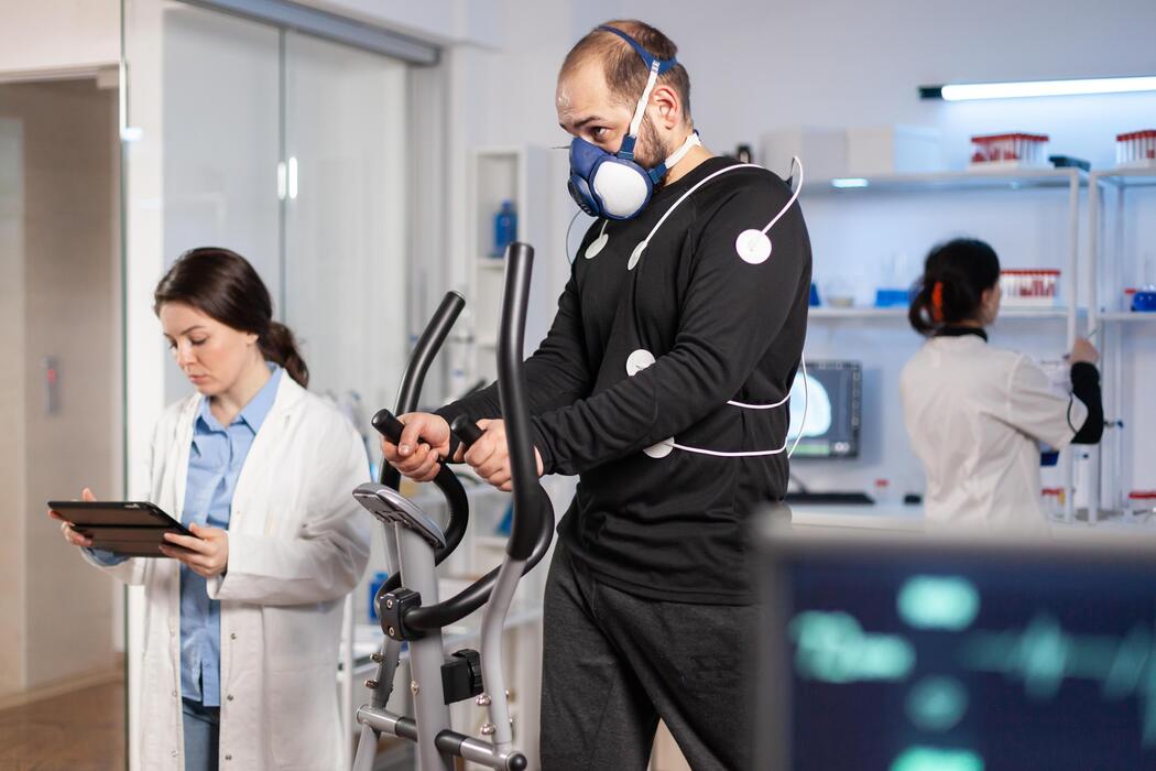 Athlete undergoing performance testing with monitoring sensors in a sports performance lab