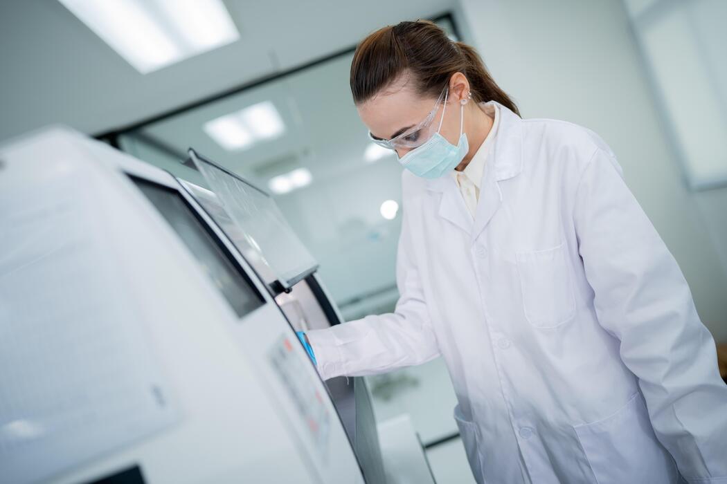 Scientist running analytical instruments in a toxicology laboratory